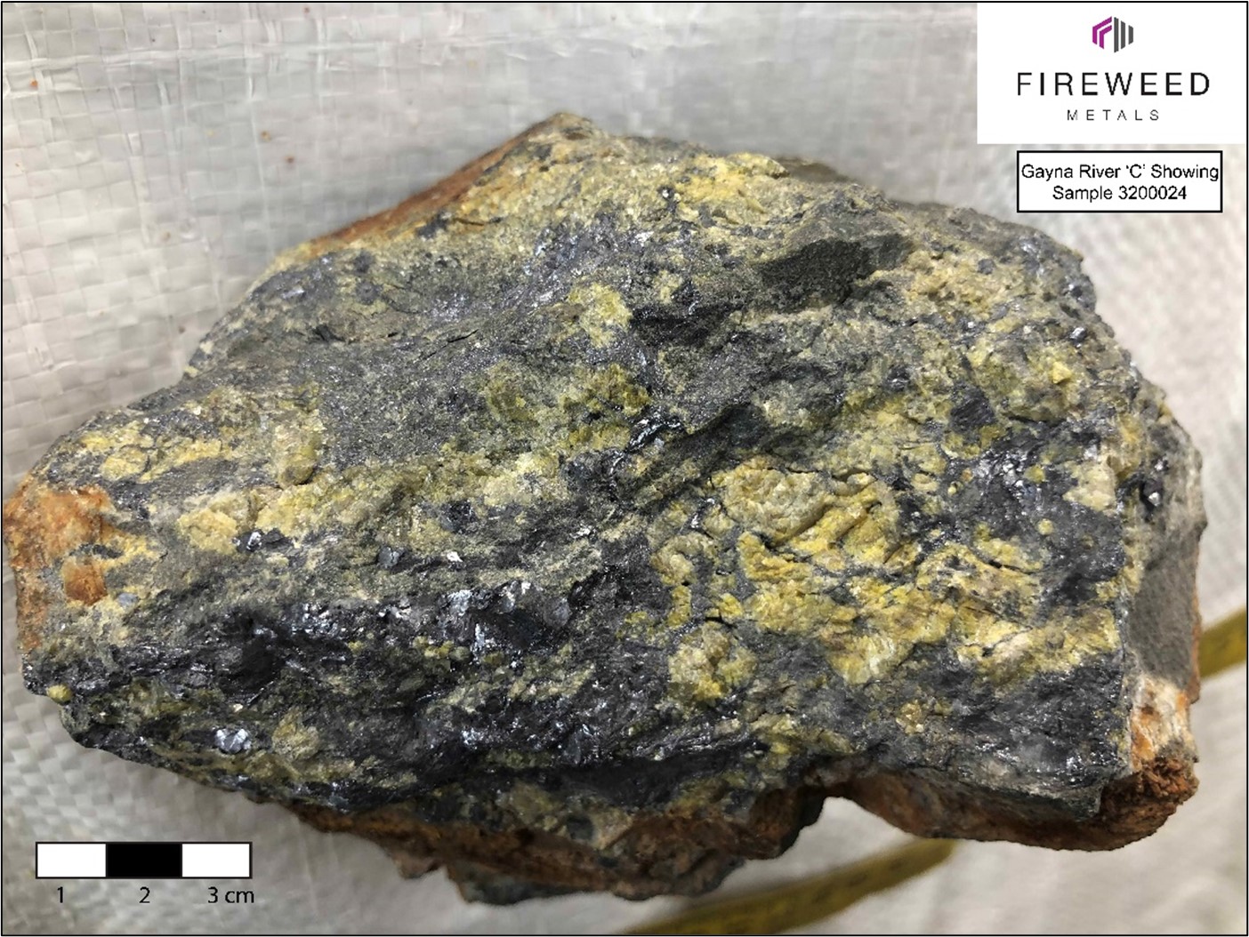 Gayna River ‘C’ showing, sample 3200024. Upper-Host massive metallic grey galena and yellow-green sphalerite